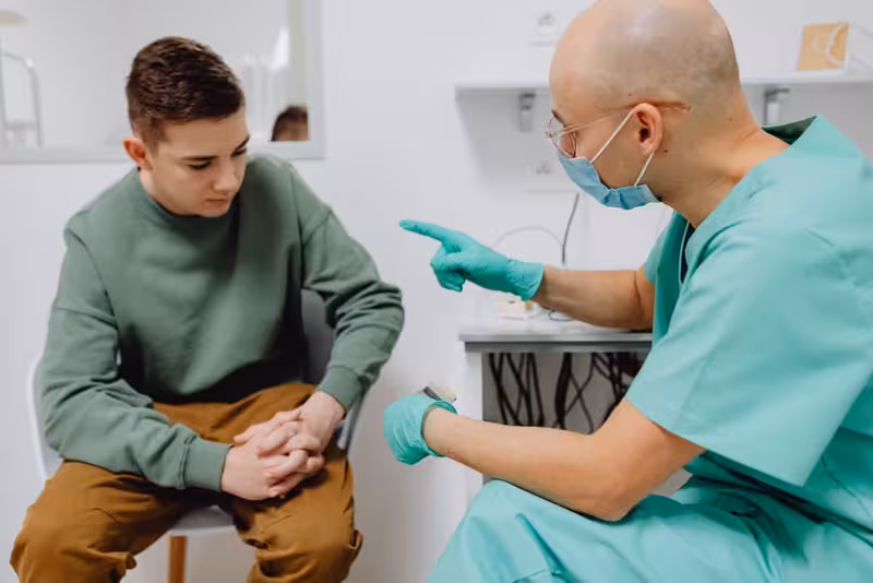 Doctor in clinic for Using Hearing First Mobile Check-In In Kingston - Hearing First Kingston Mobile Check-In Guide